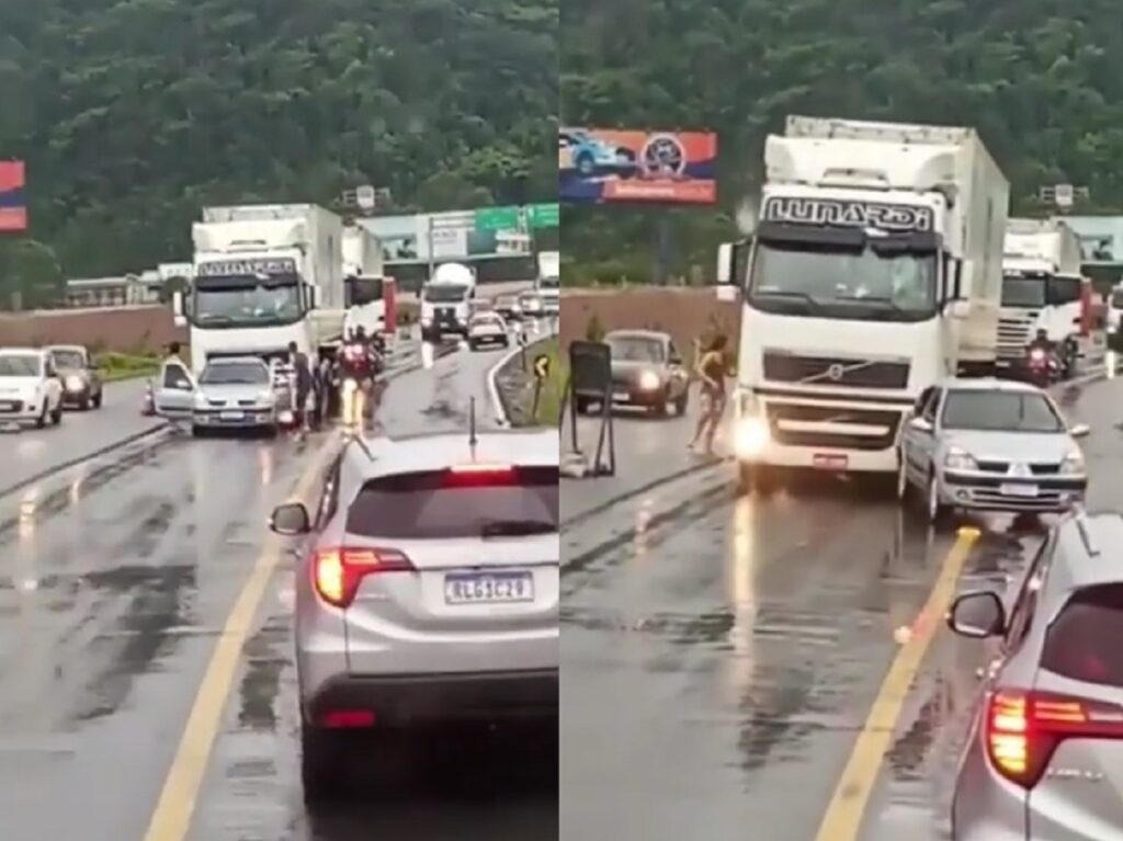 Durante briga de trânsito na BR-470 em SC caminhão empurra o carro para o outro lado da pista.