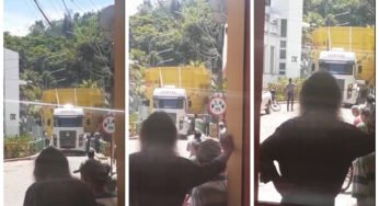 Carga gigante prende caminhoneiro na rua