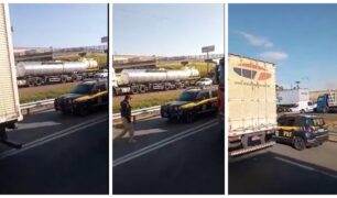 PRF flagra caminhoneiro em acostamento durante engarrafamento e desce para conversar com motorista