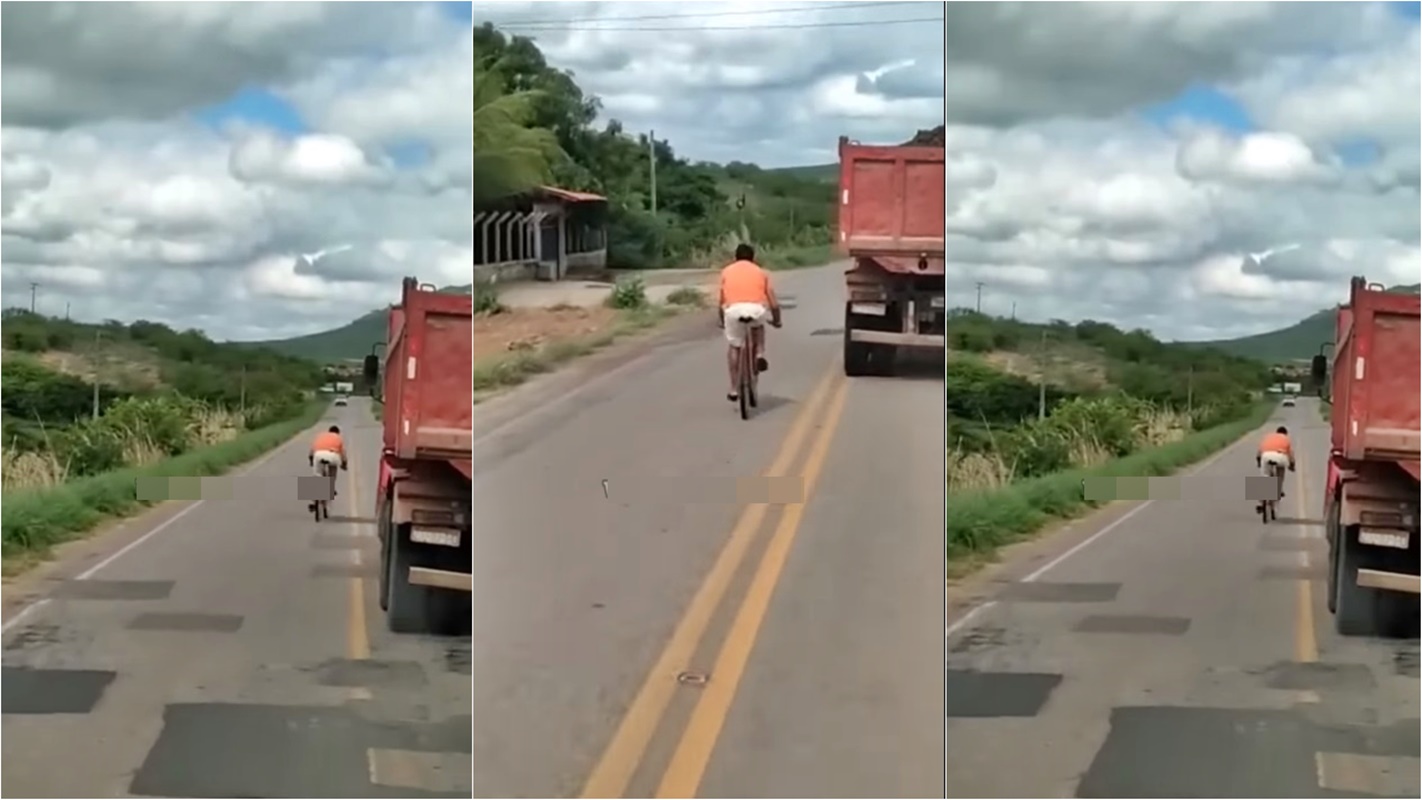 Ciclista passando caminhão