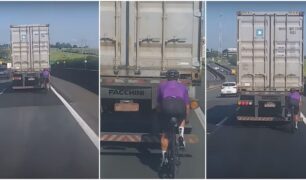 Ciclista pegando rabeira em caminhão