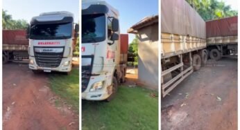 Carreta trava em manobra e caminhoneiro tenta até destelhar casa