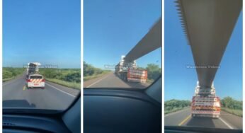 Motorista se arrisca entrando embaixo de carga superdimensionada