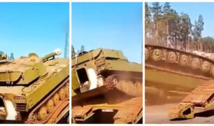 Erro de cálculo: tanque militar capota de carreta após manobra malsucedida