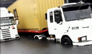 Caminhoneiros ficam com caminhões presos em cimento fresco