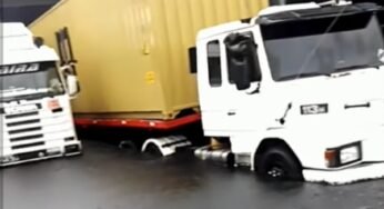 Caminhoneiros ficam com caminhões presos em cimento fresco