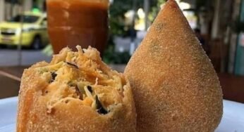 Caminhoneiro ignora placa, bloqueia rua e gera polêmica ao parar por coxinha famosa