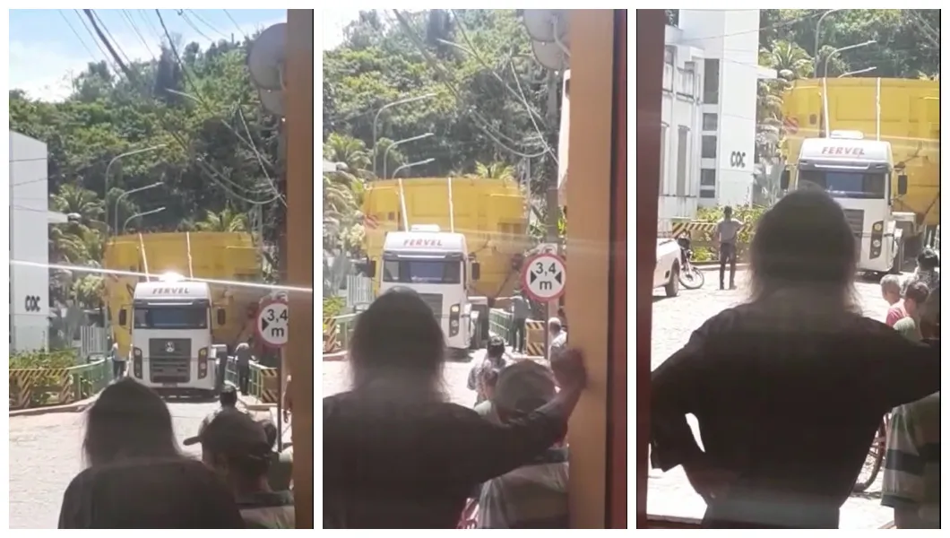 Carga gigante prende caminhoneiro na rua