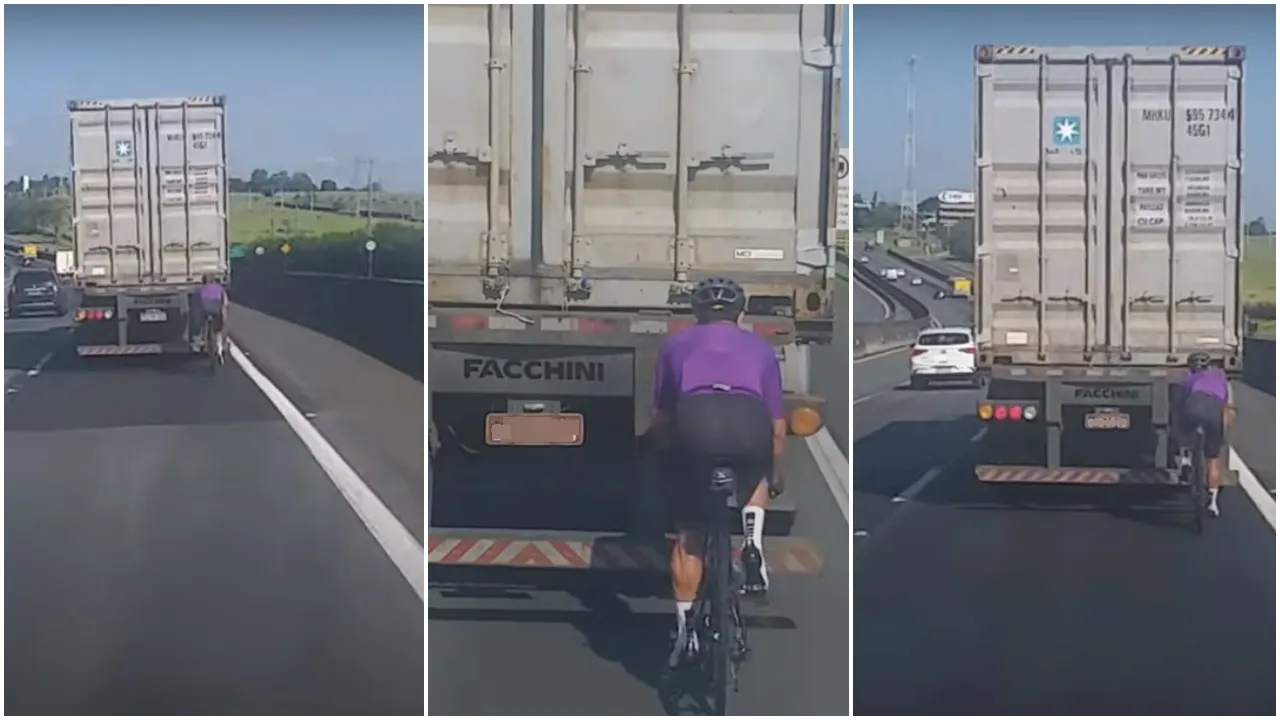 Ciclista pegando rabeira em caminhão